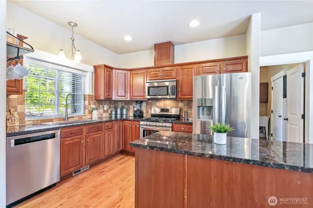 Kitchen with stainless appliances, granite counters and new stainless sink.