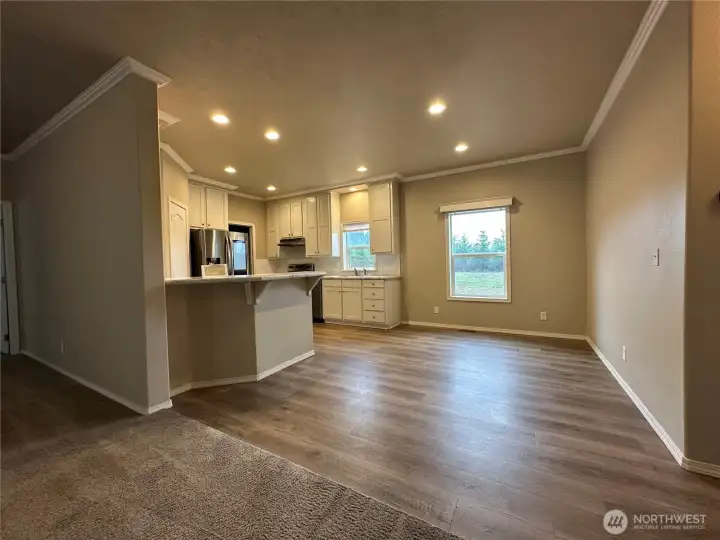 View of kitchen and dining area from living room