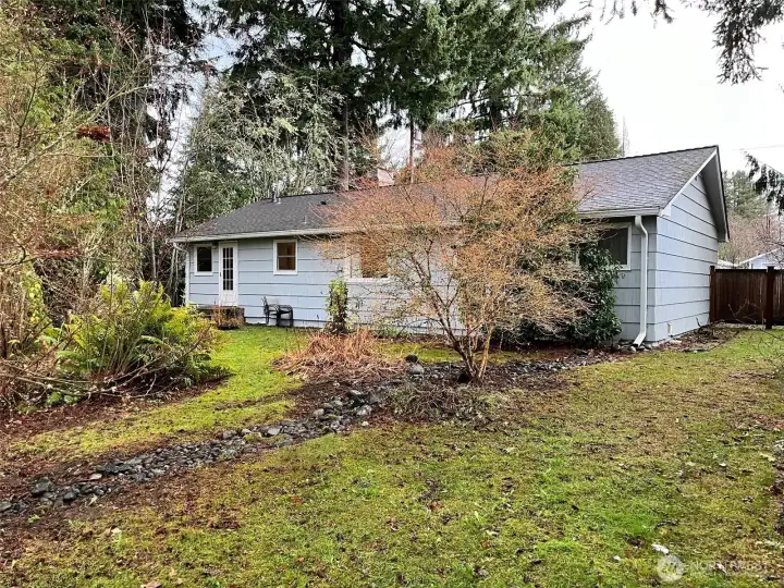 There are a couple different Dogwood tree species, Japanese Maples, and Native Cedar in the back yard. Song Birds and Bees love the yard.