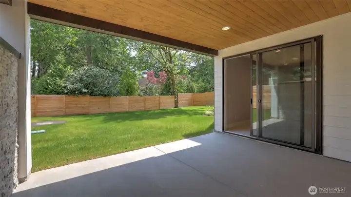 Step out from the Lower Level Rec Room to your covered patio and large, leveled backyard.