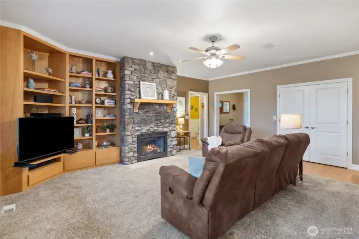 Wonderfully Crafted Built-in Shelves & Stunning Stone Gas Fireplace.