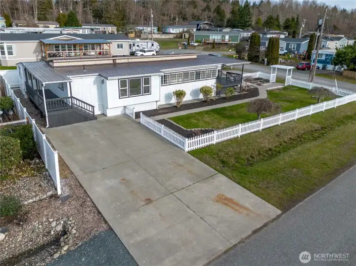 Fully fence landscaped level large lot with two driveway - ample parking space.