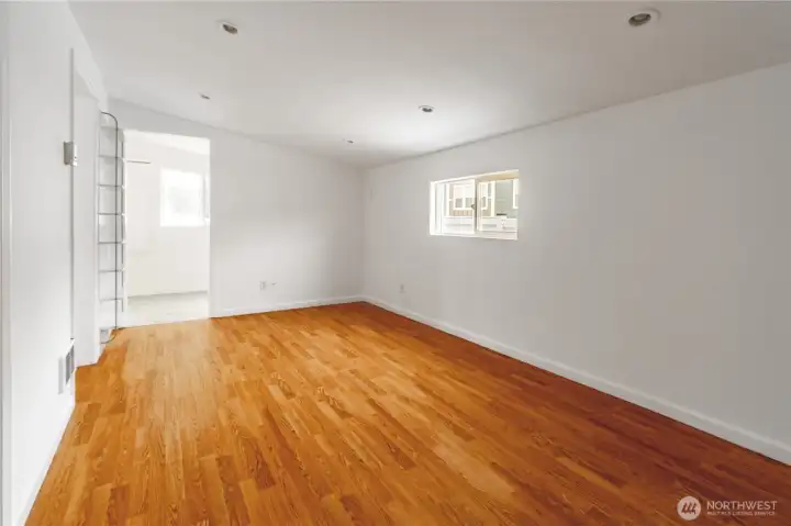 Bonus room in north west corner of home access to laundry/mud room in background