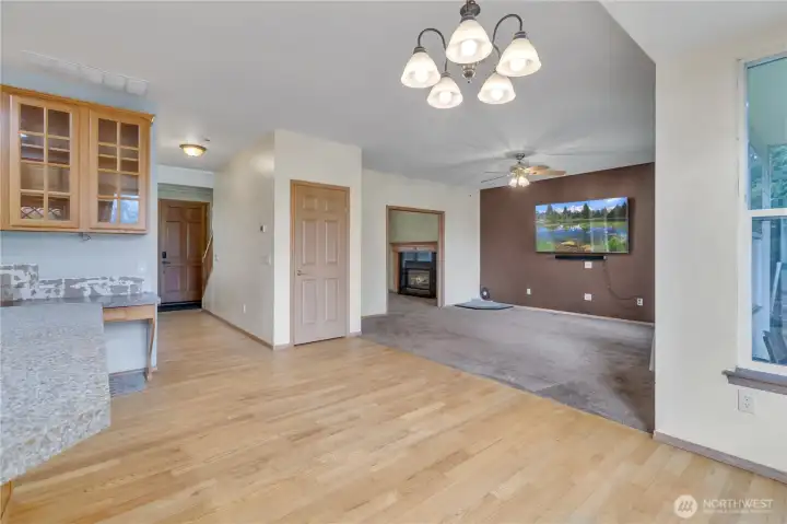 Door ahead is for a closet under the stairs. Door to the left in the distance is the front door (Which is an extra wide door)