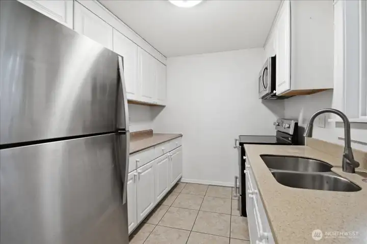 Kitchen has stainless steel appliances