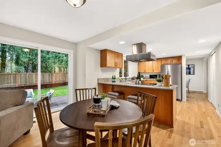 Positioned between the kitchen and the backyard, this open casual living space benefits from abundant natural light and direct patio access — a versatile layout that makes it easy to move seamlessly between cooking, dining, and outdoor relaxation.