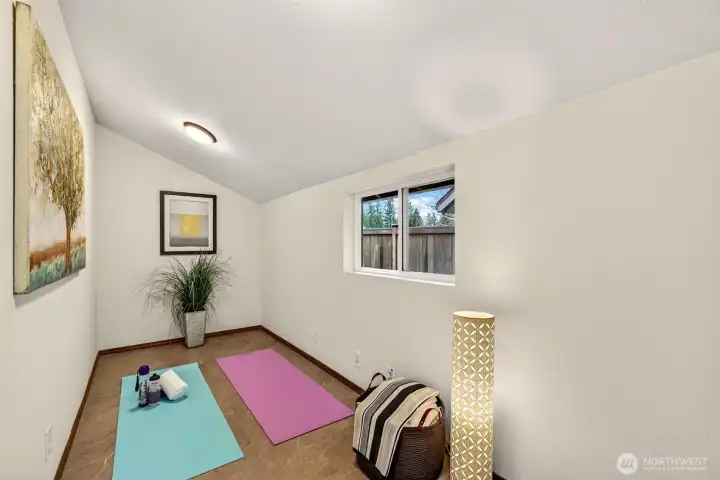 Privately positioned off of the laundry room, this versatile lower level flex room with a window overlooking the yard is ready to serve whatever your lifestyle calls for — a home office, playroom, home gym, meditation space, studio, or bonus storage area — providing flexibility and privacy that buyers rarely find in this price range.