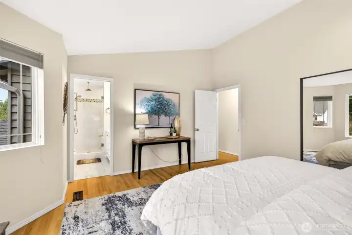The primary suite's thoughtful layout places the remodeled en suite bath and a dedicated closet just steps from the sleeping area, creating a private, self-contained retreat that makes the beginning and end of every day feel effortless.