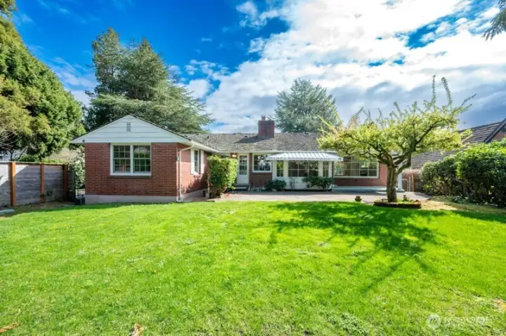 Looking east to house. Backyard is level and huge.