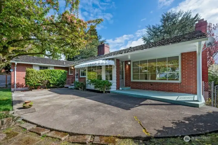 Large back patio in front of living room, dining room and kitchen.