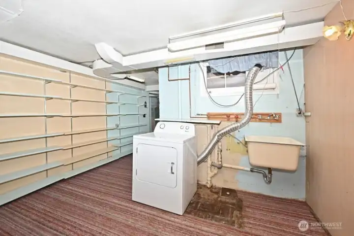 Laundry Room with lots of shelving.