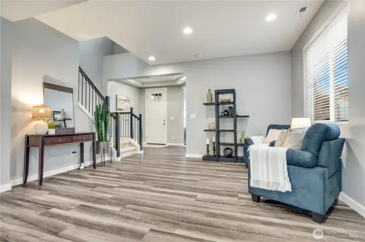 To the right of the front door is the office and half bath.