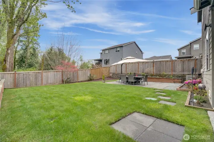 Fully fenced and backs up to green space with mature trees. Both the front and backyard have full sprinkler systems, including the garden beds.