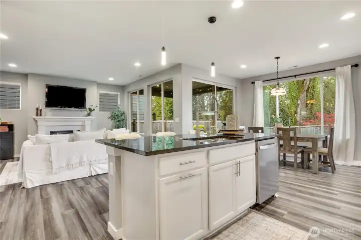 Walls of windows, 9’ ceilings and natural surround keep this home feeling well lit throughout the year.