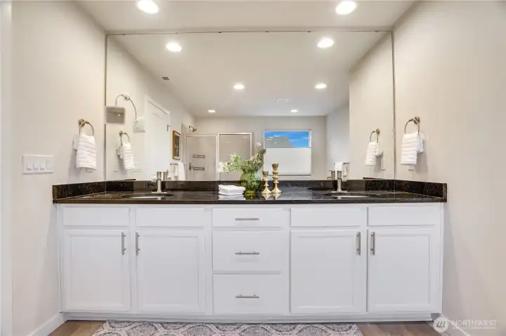 Dual vanity sink, solid stone countertops great storage space and lighting