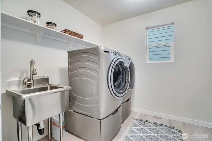 Laundry room upstairs with handy utility sink