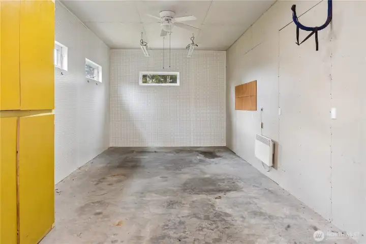 Additional heated work space inside the garage.