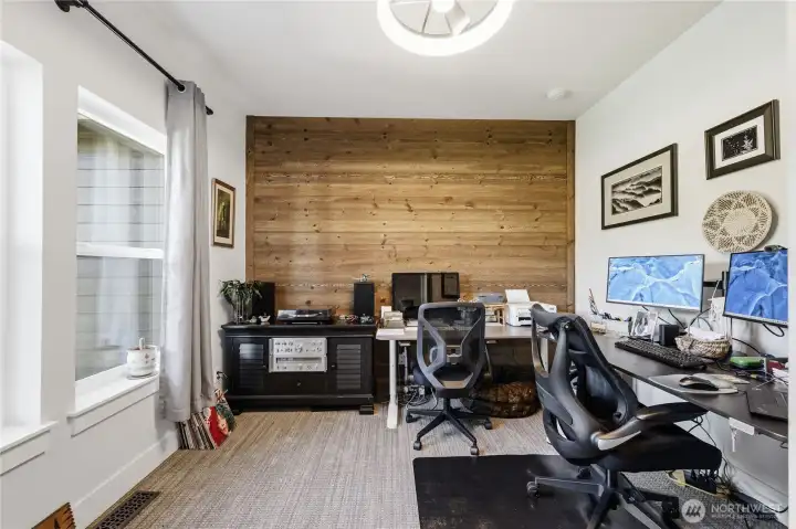 Spacious office with barnwood wall