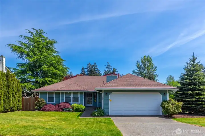 First impressions matter! This well-maintained 1987 rambler offers great curb appeal with established landscaping and a large, level driveway. The oversized 9,761 sq. ft. lot provides plenty of breathing room between neighbors. A perfect canvas for your garden or outdoor projects. First impressions matter! This well-maintained 1987 rambler offers great curb appeal with established landscaping and a large, level driveway. The oversized 9,761 sq. ft. lot provides plenty of breathing room between neighbors. A perfect canvas for your garden or outdoor projects.