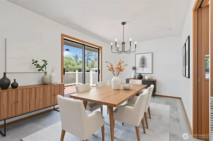 This virtually staged view illustrates the home’s incredible potential for entertaining. Imagine hosting dinners in the sun-drenched dining area, with the sliding glass door open to the back deck, while guests relax in the adjacent sunken living room under soaring vaulted ceilings. A perfect blend of style and comfort. This virtually staged view illustrates the home’s incredible potential for entertaining. Imagine hosting dinners in the sun-drenched dining area, with the sliding glass door open to the back deck, while guests relax in the adjacent sunken living room under soaring vaulted ceilings. A perfect blend of style and comfort.