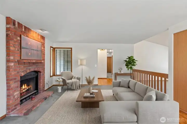 This virtually staged family room, located just off the kitchen, offers a warm and inviting retreat. Anchored by a classic fireplace and accented by rich hardwood floors, it’s the perfect spot for casual mornings or cozy evenings. This versatile "extra" room provides a secondary living space that keeps everyone connected to the kitchen hub. This virtually staged family room, located just off the kitchen, offers a warm and inviting retreat. Anchored by a classic fireplace and accented by rich hardwood floors, it’s the perfect spot for casual mornings or cozy evenings. This versatile "extra" room provides a secondary living space that keeps everyone connected to the kitchen hub.