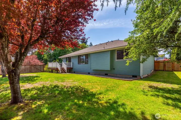 This view showcases the impressive side yard and the secure, full fencing that wraps the property. The generous width of the lot provides excellent separation from neighbors and offers plenty of room for a dog run, a storage shed, or simply extra space to enjoy the outdoors. Clean, functional, and ready for summer! This view showcases the impressive side yard and the secure, full fencing that wraps the property. The generous width of the lot provides excellent separation from neighbors and offers plenty of room for a dog run, a storage shed, or simply extra space to enjoy the outdoors. Clean, functional, and ready for summer!