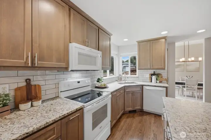Kitchen with stunning leathered granite countertops.
