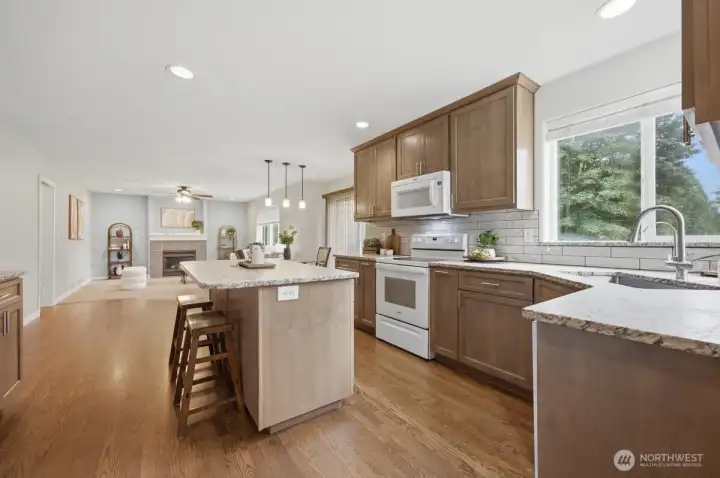 Kitchen leading to family room and eat in space.