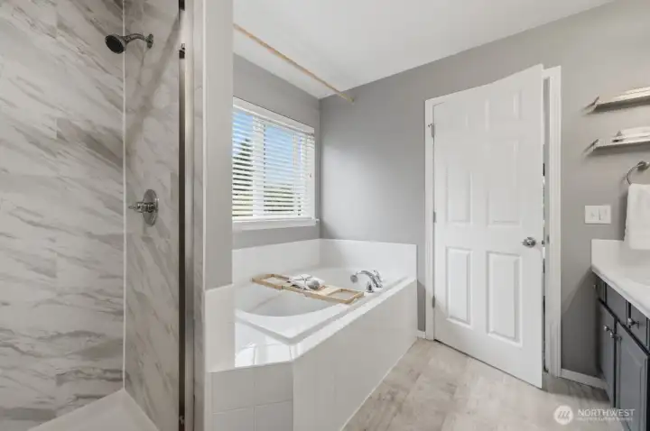 Spacious bathroom connected to primary.