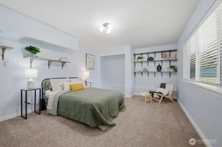 Bedroom in basement is light and spacious.
