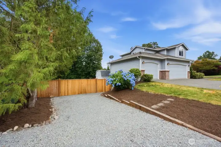 RV parking on side with fully fenced lot.