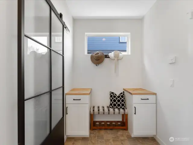 Mud room with a walk in pantry