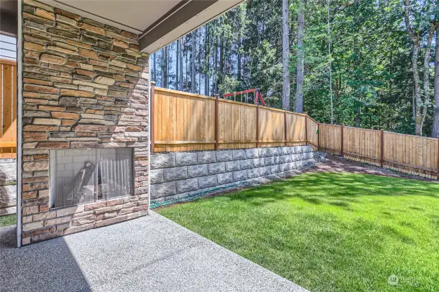 Covered patio with gas fireplace. Perfect for gatherings.