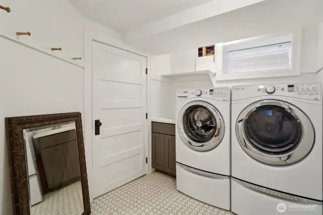 Lower level laundry room with mop sink