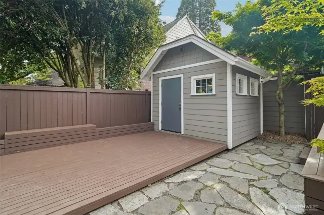 Concrete parking pad is under this deck. Easy to convert to off-street parking
