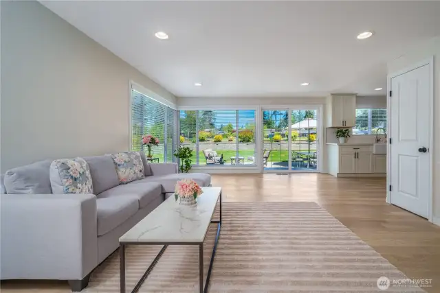 this open family room / kitchen nook or dining room area in the NW corner of the main floor can be configured in many different ways as your needs and lifestyle  wants it to be