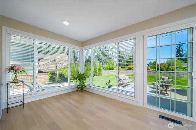 and this lovely corner with windows on both side looking at the backyard and the golf course is just a delight to hang out in