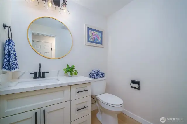 ground floor half bath, next to laundry room