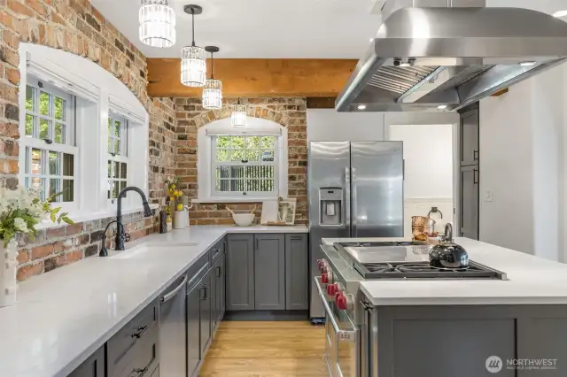 Wolf range, commercial hood, updated counters and cabinets, new hardwoods