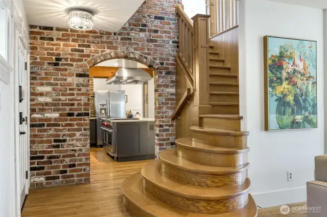 An elegant blend of exposed brick, wood and original millwork