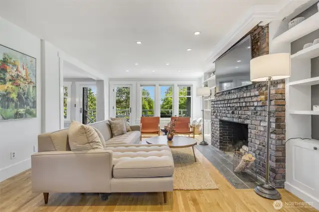 Curl up by the fire in the light-filed living room