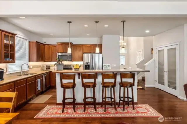 Looking from the dining area toward the kitchen. The pantry is in the double glass doors on the right.