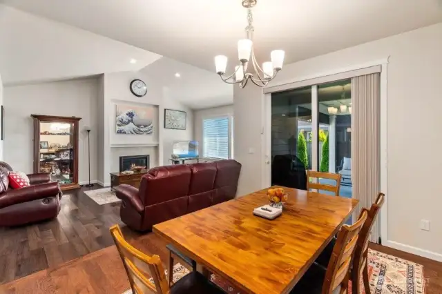 Looking from the dining room to the living room. On the right the slider leads to the covered patio.