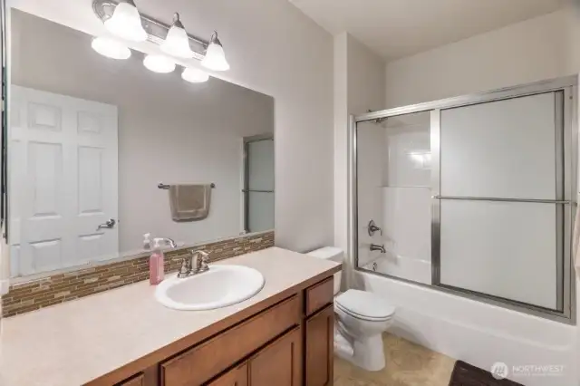 The downstairs full bathroom which sits between the front bedroom and the den/office.