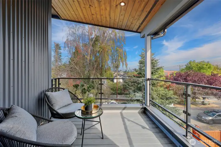 Private covered deck just off primary bedroom
