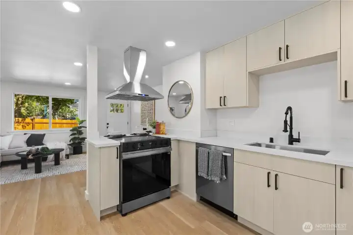 Kitchen looks into Living Room