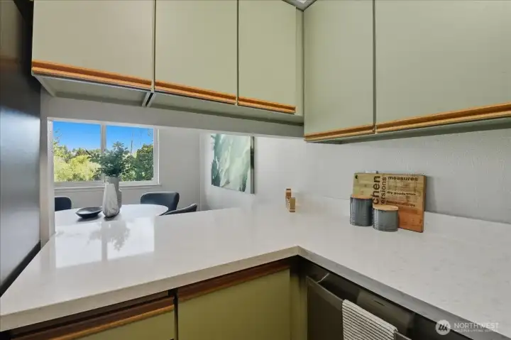 Pass through window also reflects natural light in the kitchen.