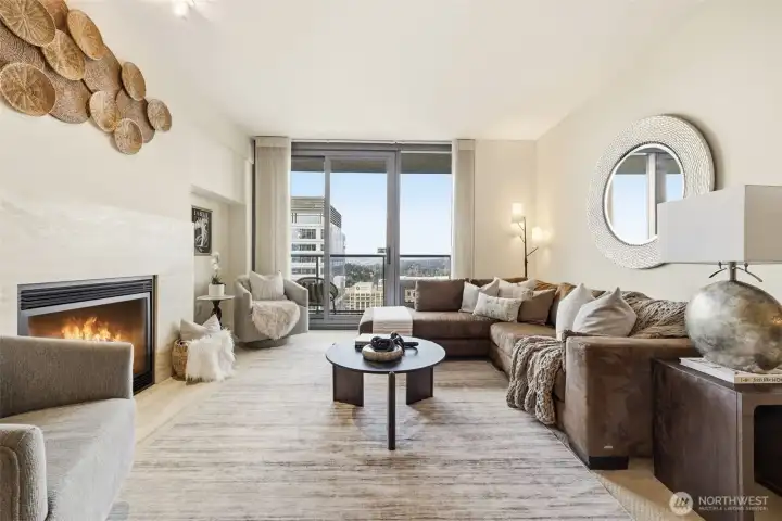 Open living area with cozy gas fireplace.