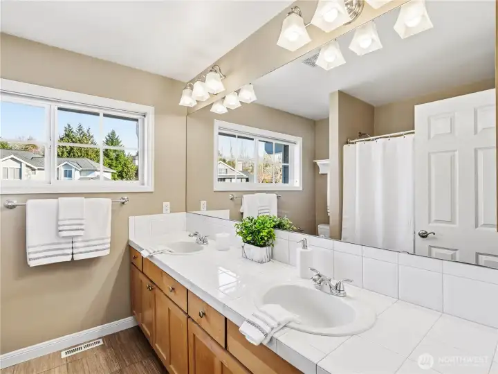 This expansive dual vanity offers plenty of room for peaceful morning routines