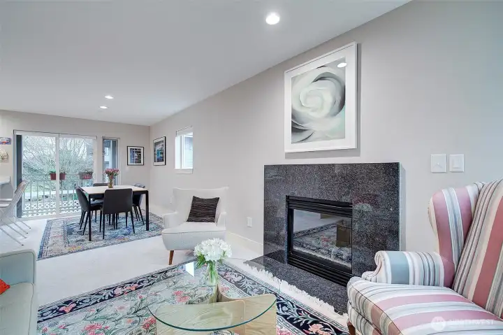 Cozy living room with gas fireplace. Great cross-breeze from the two decks.